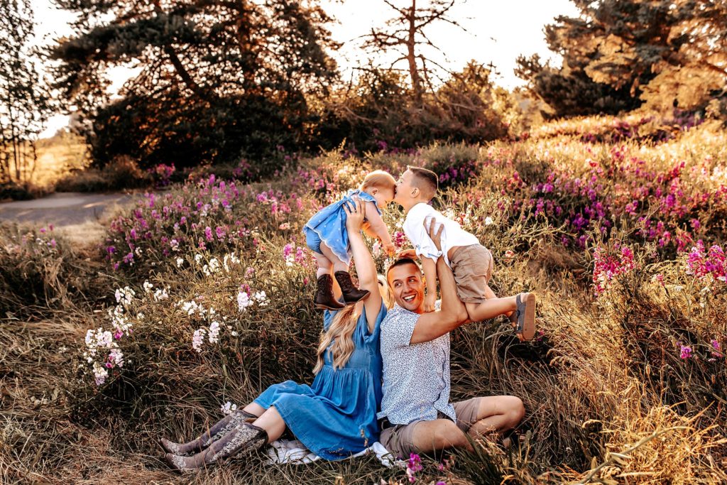 Family playing in wildflowers
